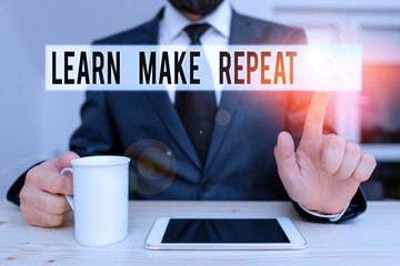 Text sign showing Learn Make Repeat. Business photo showcasing Once you do it will be easy fast learner fix mistakes Male human wear formal clothes present presentation use hi tech smartphone
