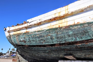 abandoned wrecked ship sitting on a trailer