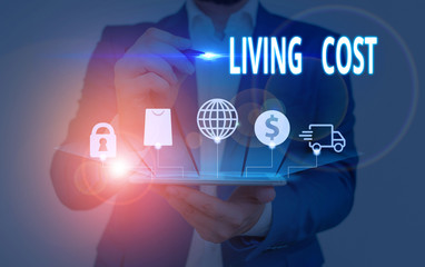 Writing note showing Living Cost. Business concept for the amount of money that a demonstrating needs to sustain life