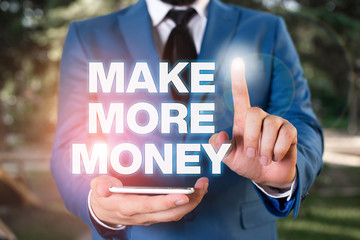 Conceptual hand writing showing Make More Money. Concept meaning Increase your incomes salary benefits Work harder Ambition Businessman with pointing finger in front of him