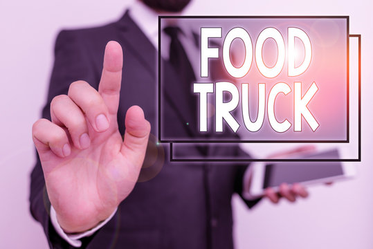 Conceptual Hand Writing Showing Food Truck. Concept Meaning A Large Vehicle With Facilities For Cooking And Selling Food Male Human Wear Formal Work Suit Hold Hi Tech Smartphone Use Hand