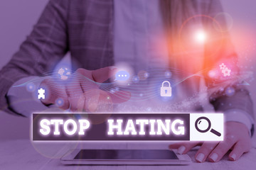 Conceptual hand writing showing Stop Hating. Concept meaning to drop all standards and...