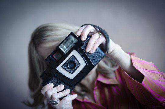 Woman Photographs With A Weird Classic Camera