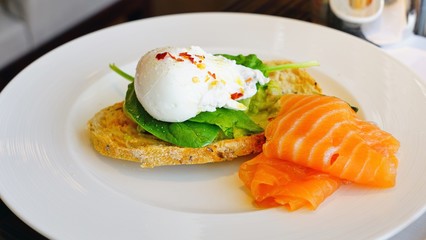 Avocado toast with poached egg and smoked salmon