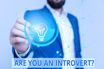 Text sign showing Are You An Introvertquestion. Business photo text demonstrating who tends to turn...