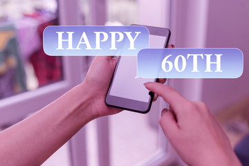 Text sign showing Happy 60Th. Business photo text a joyful occasion for special event to mark the 60th year woman using smartphone office supplies technological devices inside home