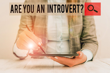 Writing note showing Are You An Introvertquestion. Business concept for demonstrating who tends to...