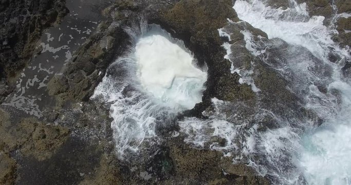 Aerial drone shot off a decent into the mouth of Thor&rsquo;s Well located at Cape Perpetua Oregon coastline near the seaside city of Yachats