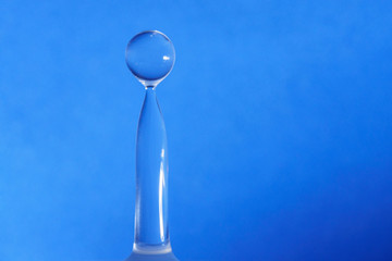 Water drop collision form with blue background
