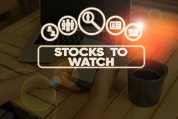 Conceptual hand writing showing Stocks To Watch. Concept meaning being heavy broker and watch every...