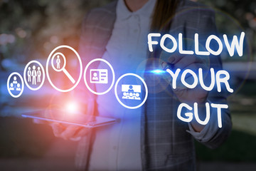 Conceptual hand writing showing Follow Your Gut. Concept meaning Listen to intuition feelings...