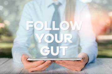 Handwriting text writing Follow Your Gut. Conceptual photo Listen to intuition feelings emotions...
