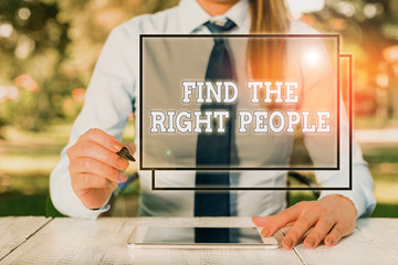 Text sign showing Find The Right People. Business photo showcasing look for a Competent demonstrating Hire appropriate Staff Female business person sitting by table and holding mobile phone