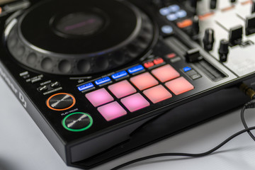 Professional concert dj turntables player device with sound mixer panel and jog wheel.Club disc jockey stage equipment for playing music on party.Digital turn table deck for nightclub