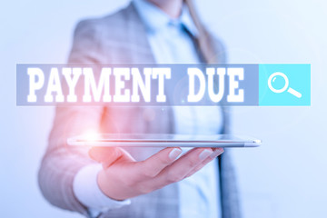 Writing note showing Payment Due. Business concept for The date when payment should be received by the company Business concept with mobile phone and business woman