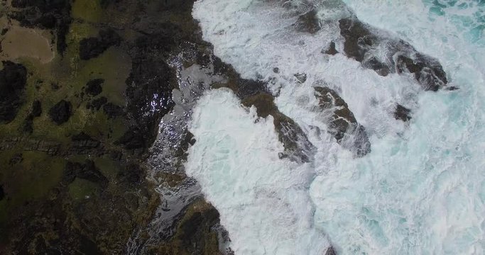 Reverse zoom pullout aerial drone shot of Thor&rsquo;s Well, the most magnificent ocean natural wonder on the coast of the Pacific Northwest of Oregon in the United States of America, USA.