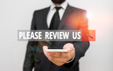 Word writing text Please Review Us. Business photo showcasing Give a feedback Opinion Comments Quality of service Male human wear formal work suit hold smart hi tech smartphone use one hand