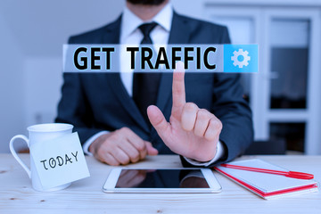 Text sign showing Get Traffic. Business photo text amount of data sent and received by visitors to a website Male human wear formal clothes present presentation use hi tech smartphone