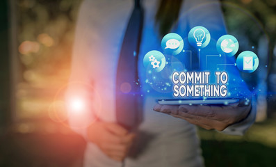 Writing note showing Commit To Something. Business concept for To Live a Life of Purpose with Pride Honor a Promise