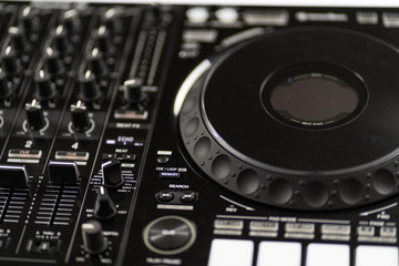 Fototapeta premium Cable to connect professional DJ midi controller to audio mixer.Concert equipment for home party.Disc jockey technology to mix digital music tracks.RCA audio cables