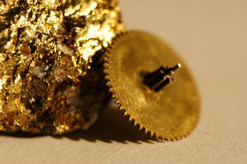 vintage non-ferrous gears. against the background of the mineral pyrite