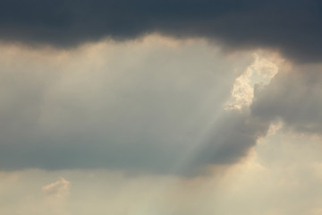 Fototapeta na wymiar sunlight through cloud on dramatic sky after the rain