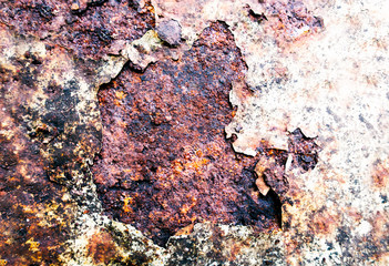 Rough and battered green paint texture on a rusted metal surface showing scratches, dents and rust patches