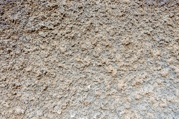 Gray plastered wall, patterned background, indented protruding texture