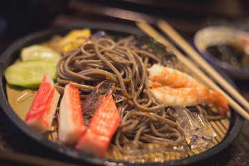 Soba with sea food, cold noodle from Japan serve with crab and shimp meat eating with miso soup