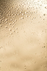 window with rain drops on beige background
