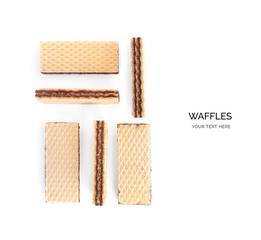 Creative layout made of waffles isolated on white background.Flat lay. Food concept.