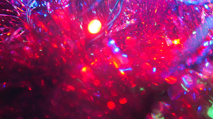 Christmas colorful New Year's Bokeh neon lights. Abstract Blurred photo background with blinking...