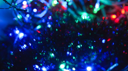 Christmas colorful New Year's Bokeh neon lights. Abstract Blurred photo background with blinking...