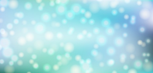 Blue bokeh background. Christmas glowing lights with sparkles. Holiday decorative effect.