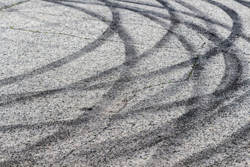 Black tracks on the pavement from a drift car.