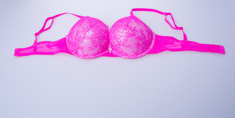 bra or pink colour bra on white background.