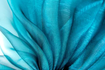 Foto op Plexiglas close-up van de golvende organza stof © severija