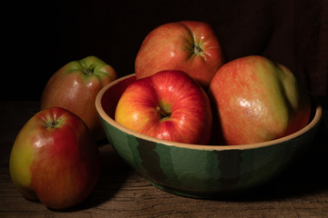 Textured ripe apples on old wood