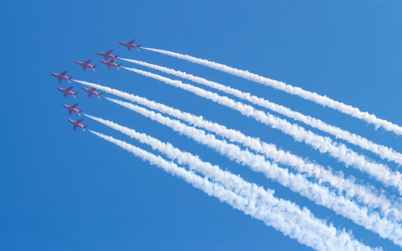 Jet plane flying in blue sky wiht Colorful smoke.Aerospace exhibition at airshow in Zhuhai, Guangdong Province of China.