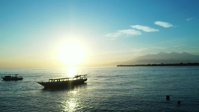 Samoan Island - Silhouette Of Boats Floating By The Sea On Golden Hours - Wide Shot