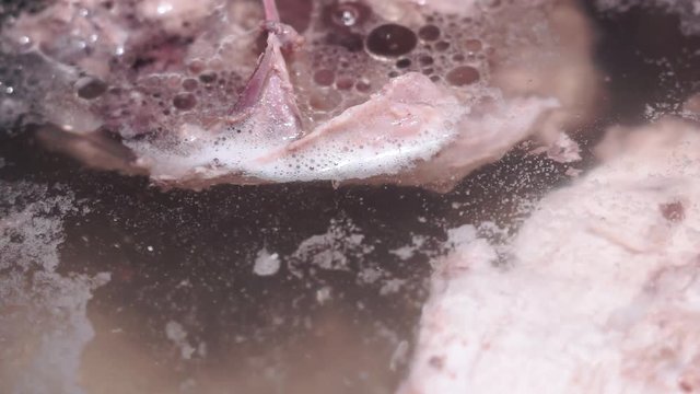 Cooking soup, boiled meat in water. Poultry, boiled chicken, close-up