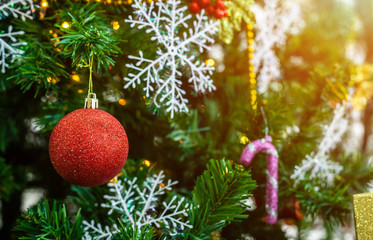 Close up of Colorful balls on Green Christmas tree background Decoration During Christmas and New Year.