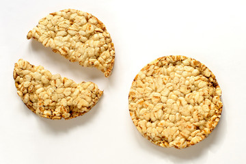 slices of wheat slimming crispy rice cakes on a white back