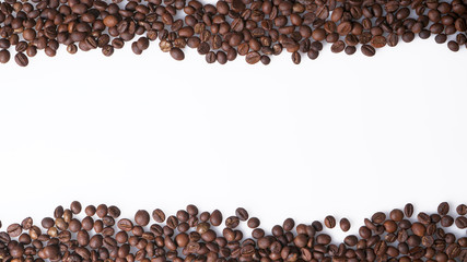 Arrangement of coffee beans on white with space for copy