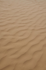 Fototapeta na wymiar Background texture of sand with dunes