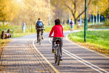 Cyclist ride on the bike path in the city Park