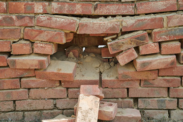 Large hole in the brick wall