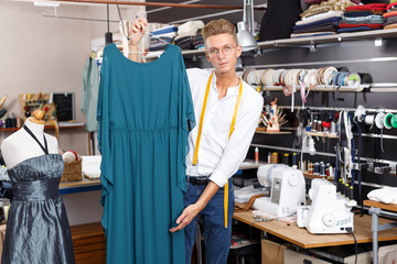Fashion designer demonstrating dress