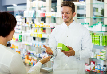 Glad man druggist in white coat