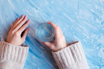  glass of pure water on blue background. 